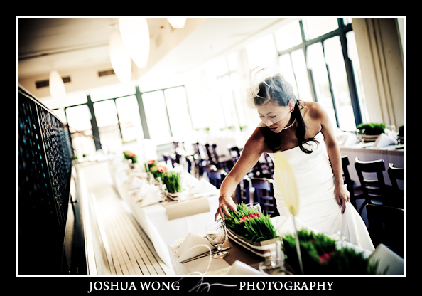The bride Stacey checked the table centerpieces before the guest enter. Bubby's Restaurant in DUMBO Brooklyn.