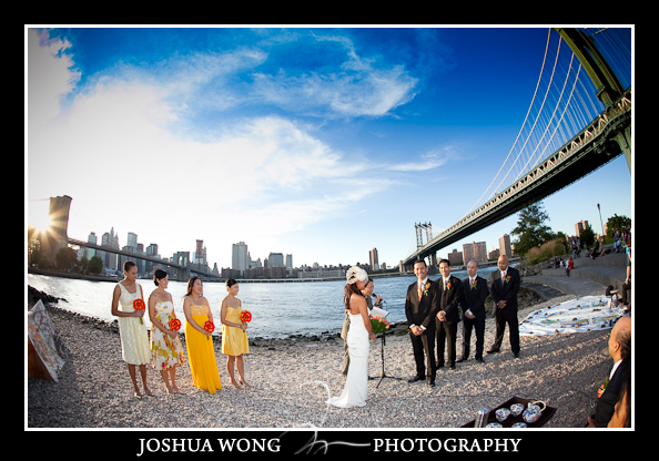 The bride and groom have their sunset ceremony on the beach in between Brooklyn Bridge and Manhattan Bridge. Brooklyn Wedding Photography