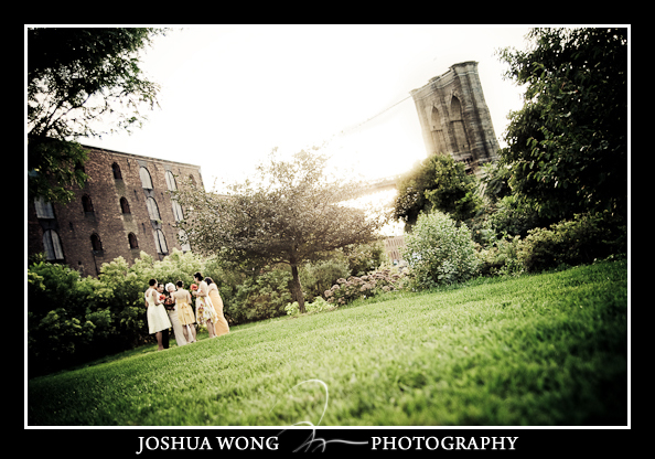 The bride and groom have their sunset ceremony on the beach in between Brooklyn Bridge and Manhattan Bridge. Brooklyn Wedding Photography