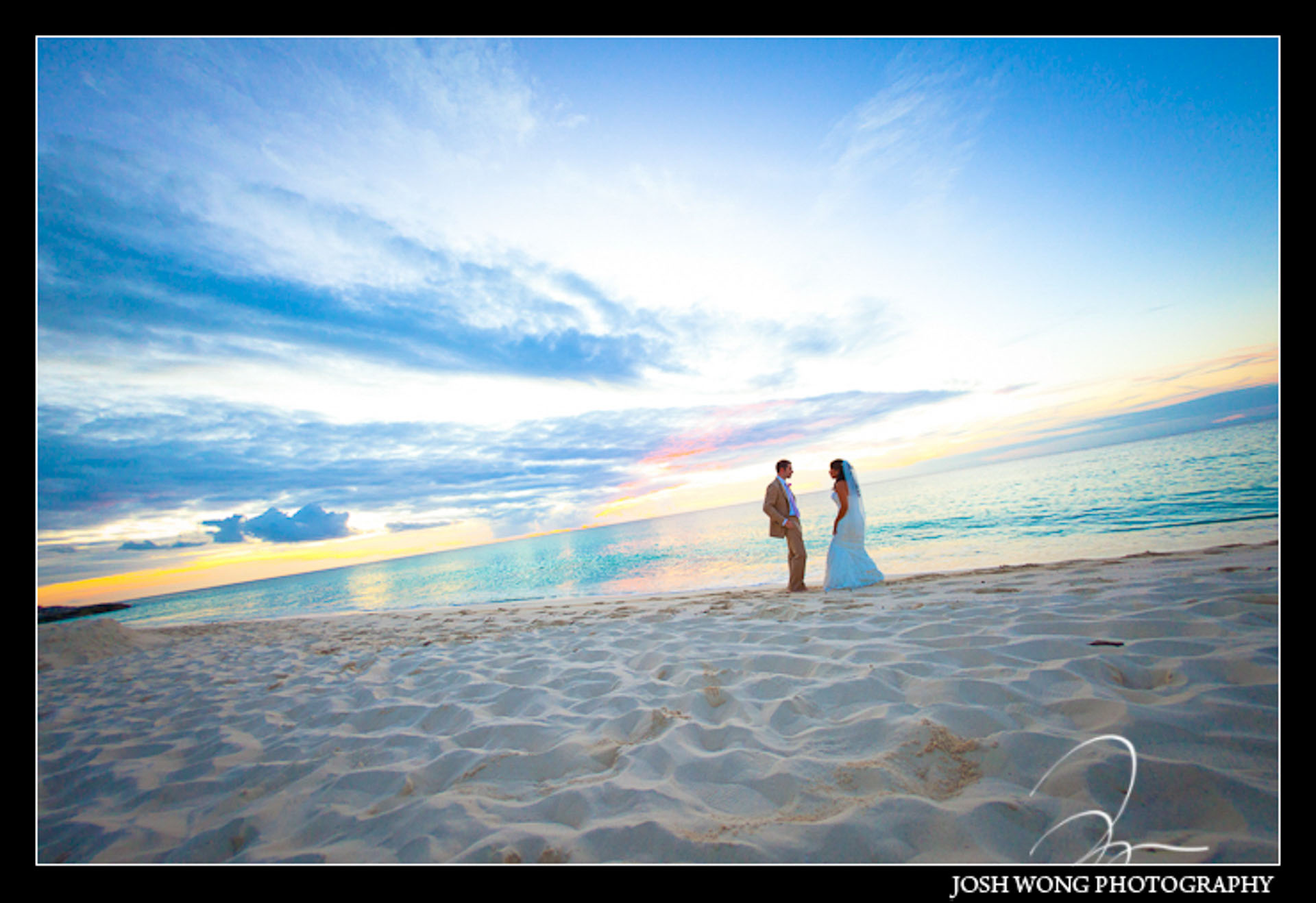 A majestic destination wedding sunset on the beaches of the Providenciales Turks and Caicos.