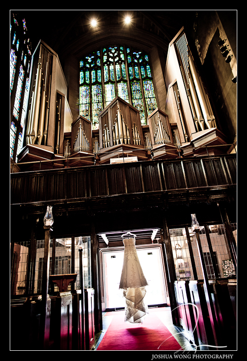The dress is hung for display in the church sanctuary for the wedding dress shots. A Park Avenue Christian Church Wedding Photography by Josh Wong Photography