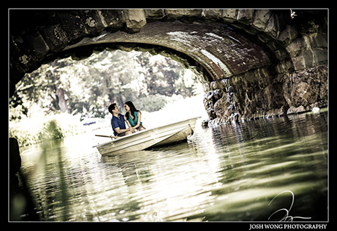 An engagement photo at Stow Lake in Golden Gate Park in San Francisco. Boats can be rented at the Boathouse. Engagement photo by top San Francisco Wedding Photographer Josh Wong Photography