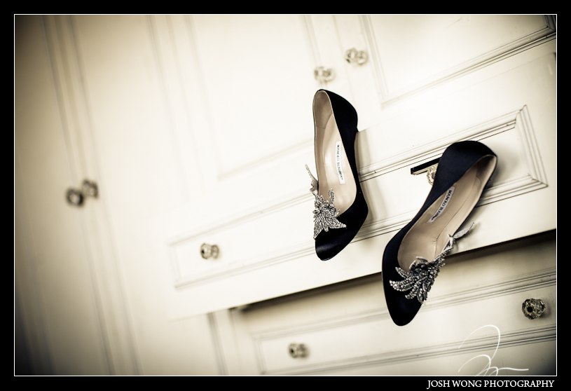 MANOLO BLAHNIK black wedding satin pumps hung from the draws at the Metropolitan Building in Long Island City