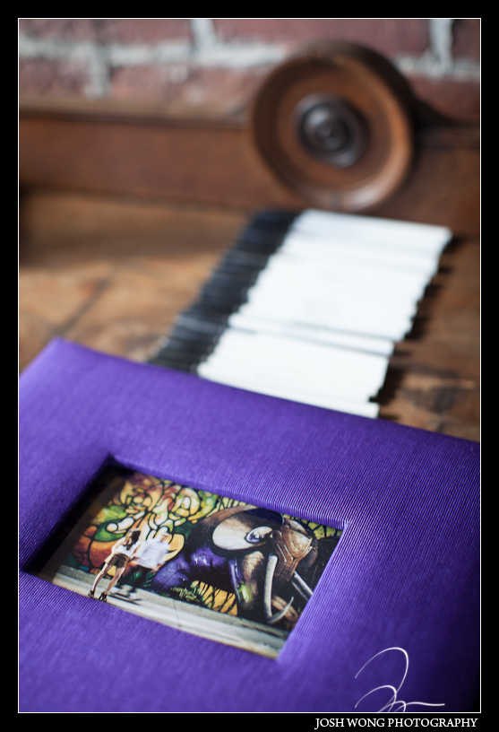 A sign in guest book featuring their engagement pictures taken with their wedding photographer Josh Wong Photography
