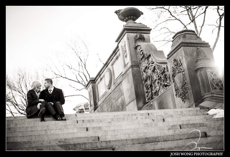 The couple sitting on the top steps of Bethesda Terrace enjoying a moment together.