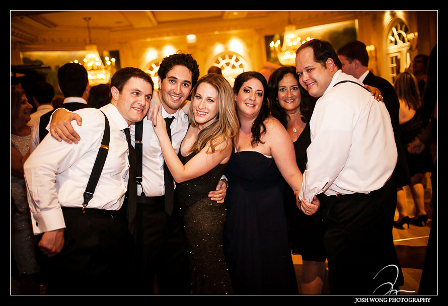 Friends and family having a blast at the wedding reception.