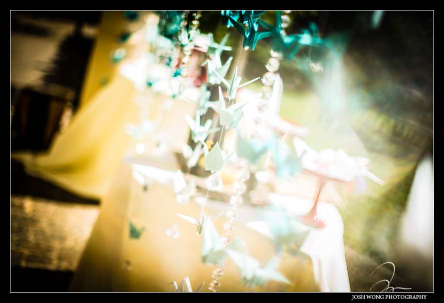 Wedding ideas. The bride folded 1000 origami japanese cranes to decorate area of the ceremony and reception. Wedding pictures by Bay Area wedding photographer Josh Wong