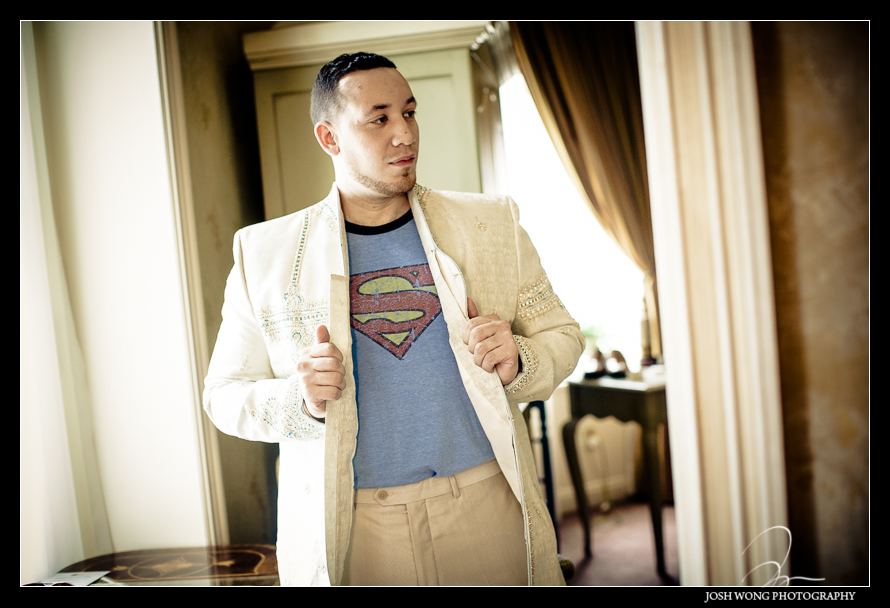 The groom with a superman t-shirt underneath his tux.