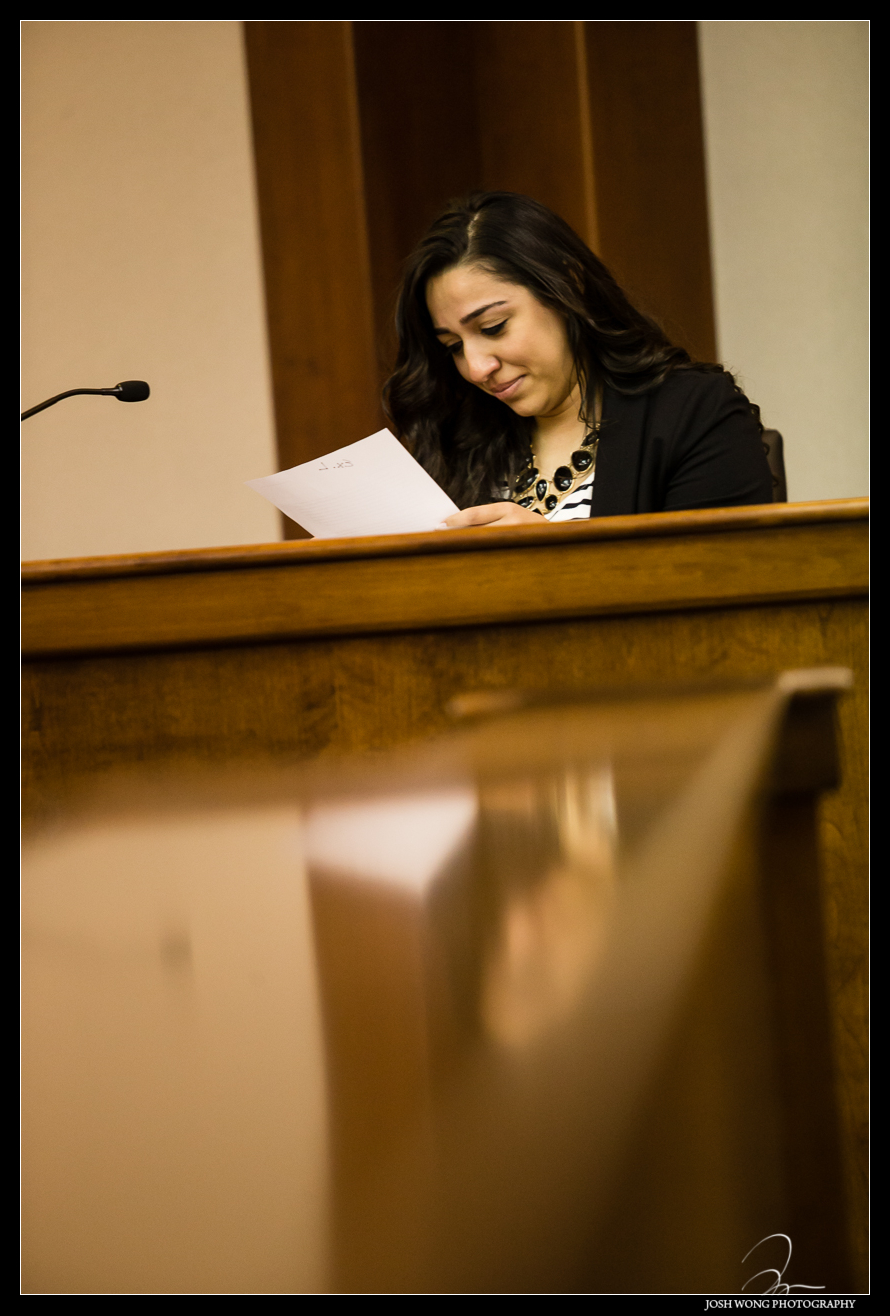 Christina and Anthony inside of the New Jersey courthouse reading a letter  from Anthony.  Anthony's surprise wedding and marriage proposal to Christina in a Mock Courtroom Trial.