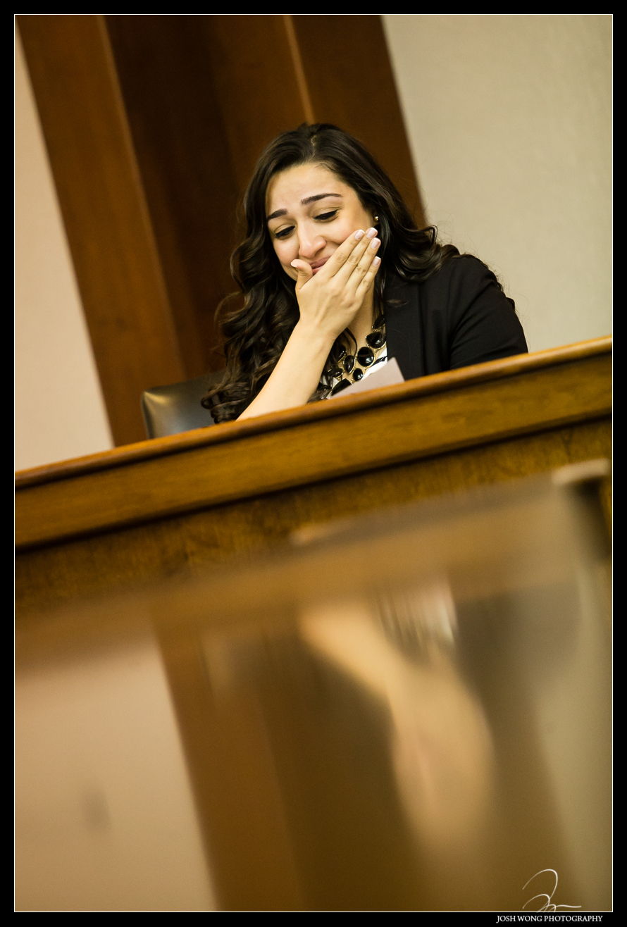 Christina and Anthony inside of the New Jersey courthouse reading a letter  from Anthony.  Anthony's surprise wedding and marriage proposal to Christina in a Mock Courtroom Trial.