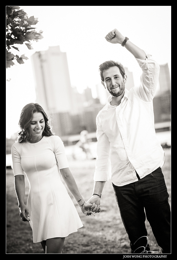 Taking photos at Brooklyn Bridge Park engagement photos