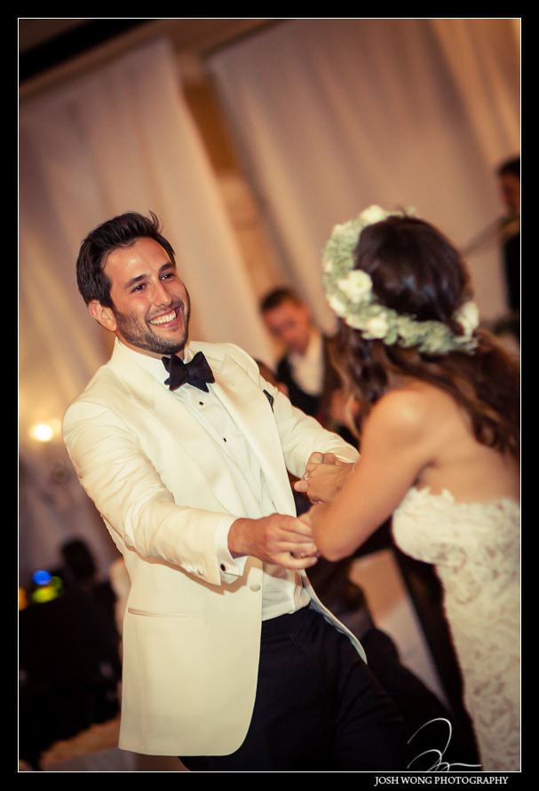 The bride and groom have their first dance.