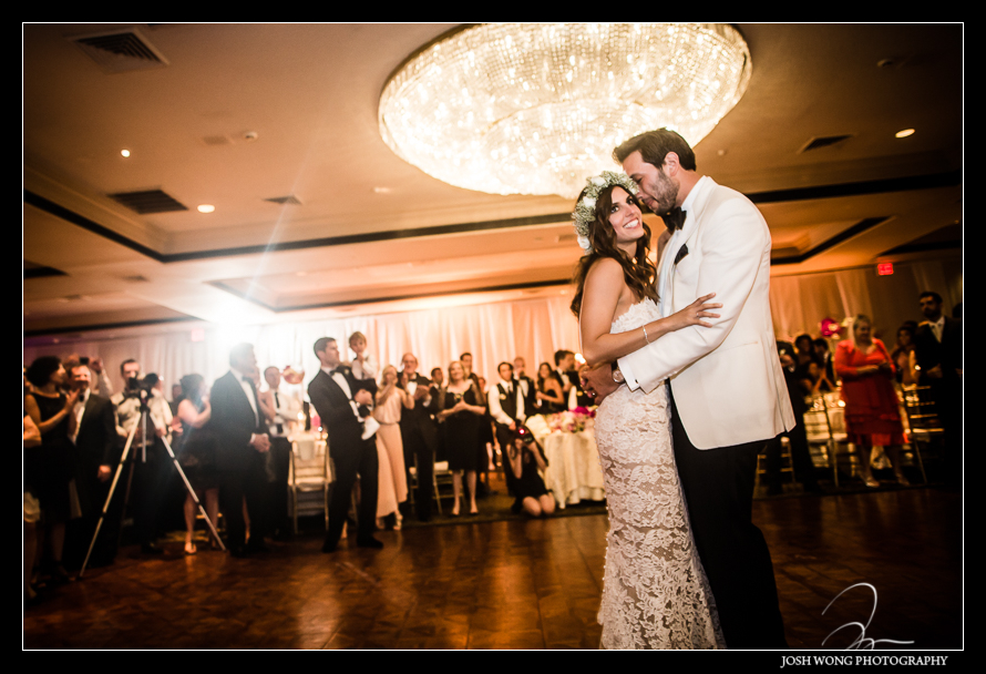 The bride and groom have their first dance.