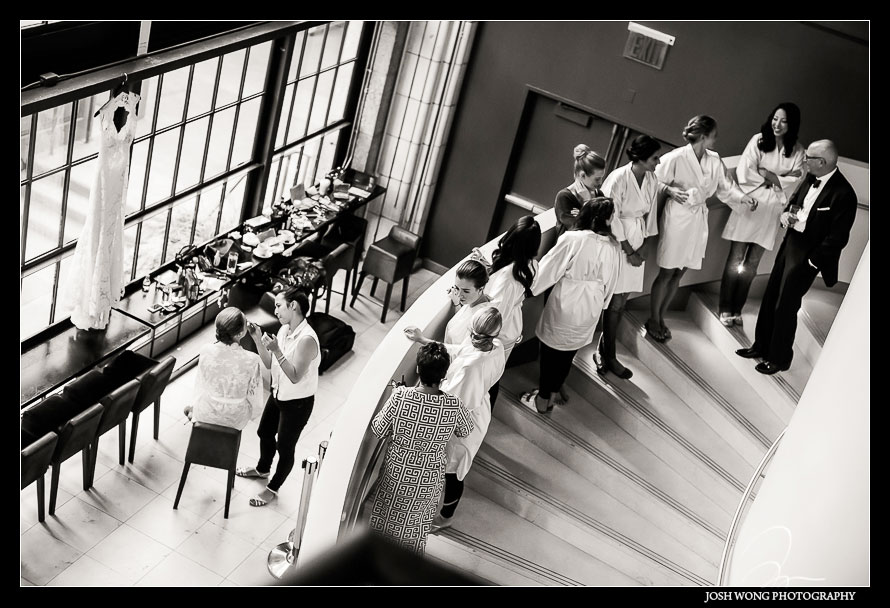 The bride got into Guastavino's early to do her hair and makeup with the bridal party watching on the staircase. Wedding photos by NYC Wedding photographer Josh Wong