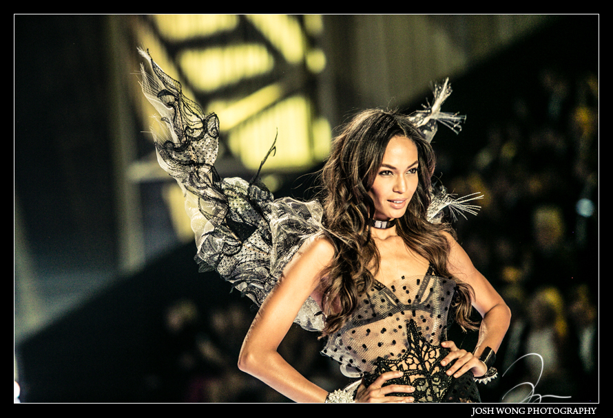 Joan Smalls poses for the television camera at the 2014 Victoria's Secret Fashion Show in London. photo by Josh Wong Photography
