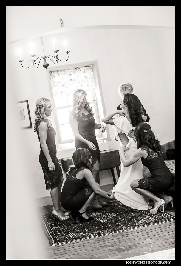 The bride adorns her wedding dress by BHLDN. Brandywine Manor House