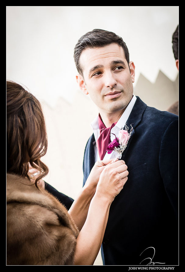 After a quick first look the bride readjust the grooms flower. Bandywine Manor House