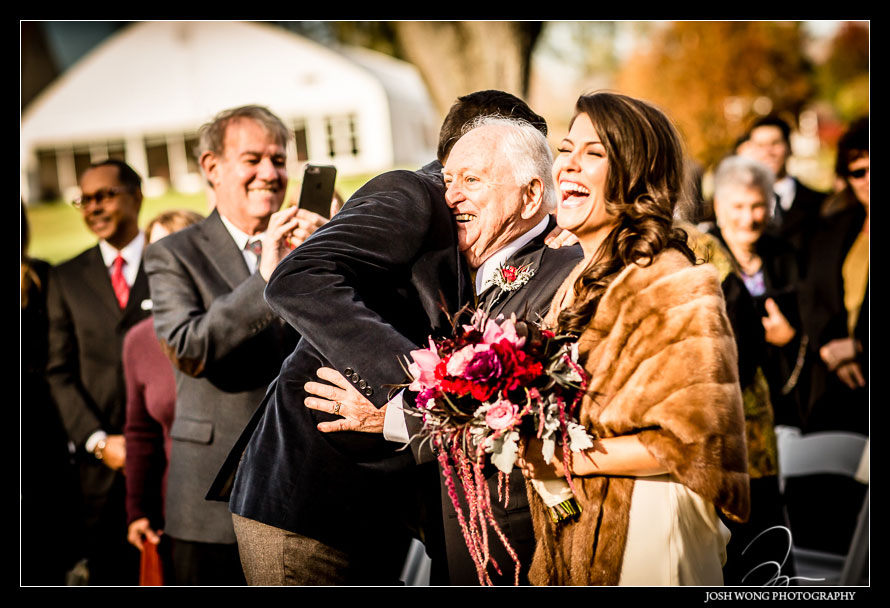 The father of the bride with a heartfelt embrace as he give away the bride. Brandywine Manor House