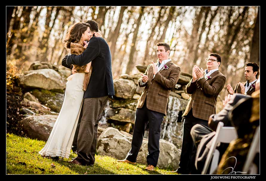 The beautiful couple have a gorgeous sunset lit fall wedding ceremony. Brandywine Manor House.