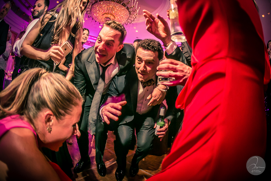 Guest dancing the night away to the music from the live band.  A Lotte New York Palace Hotel Wedding by top NYC wedding photographers Josh Wong Photography