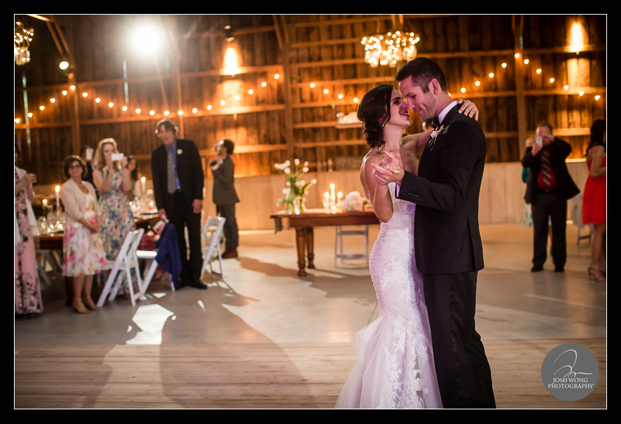 The married couple have their first dance with guest and friend. Best wedding candid moments during a dance set. A Stone Tavern Farm Wedding in Roxbury NY with wedding pictures by top photographer Josh Wong Photography