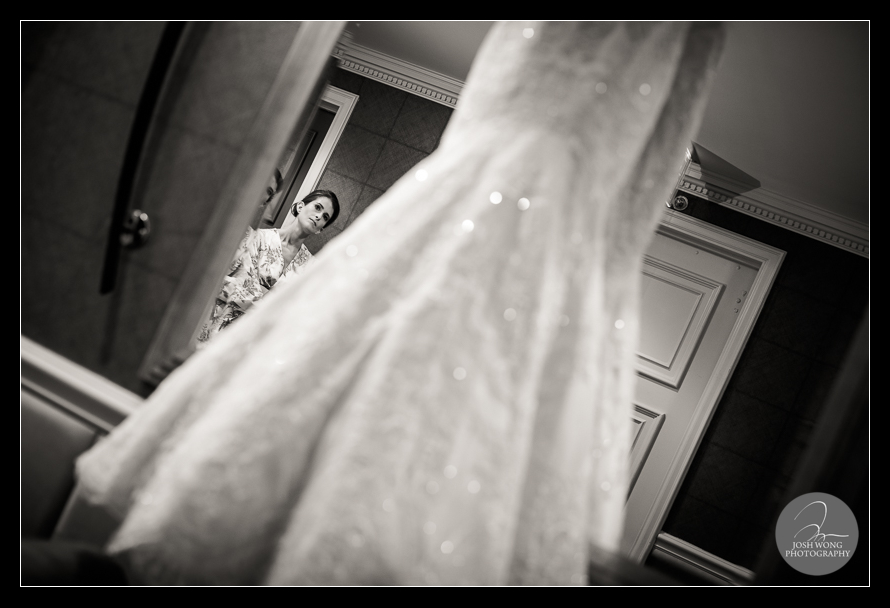 A bridesmaid glances at the Vera Wand wedding dress.