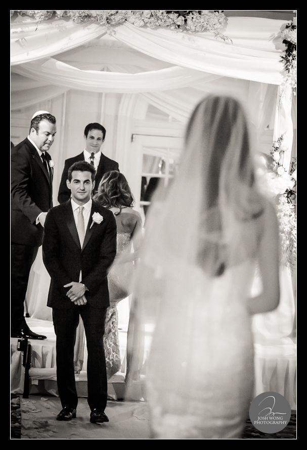 The groom watching the bride walking down the aisle. JW Marriott Essex House Wedding. Wedding Pictures and photos provided by Josh Wong Photography, New York City