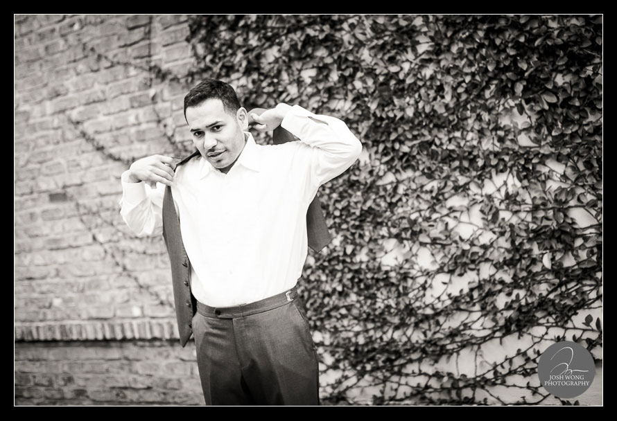 The groom puts on his vest. Bella Collina wedding photos taken by top Florida Wedding Photographer Josh Wong Photography.