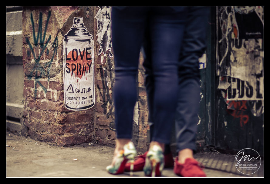 The street art in Soho provide amazing edgy images for engagement photos. Love Spray street art. 