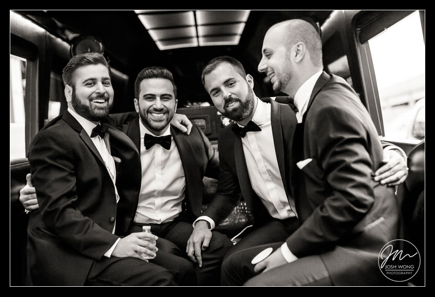 The groom and his groomsmen on the party bus en route to the ceremony, St. Vartan Cathedral.  New York Wedding pictures by Armenian wedding photographer Josh Wong Photography