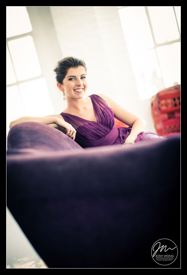 Beautiful bridesmaid wearing a dress that matching the decorative sofa. 