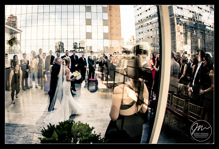 The bride, escorted by her father start their way down the aisle. wedding photography by Josh Wong Photographer - Studio 450 Rooftop Wedding