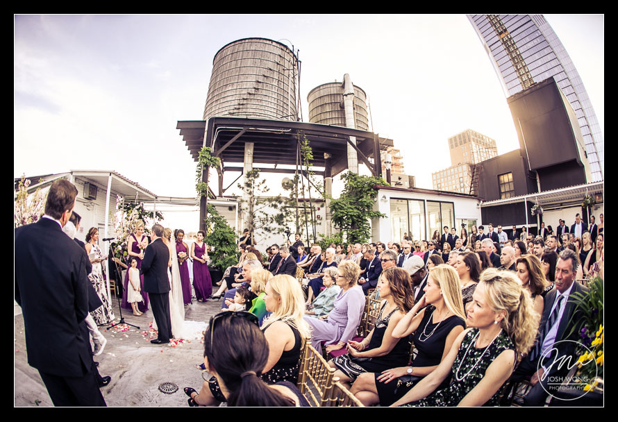 A view a the entire rooftop wedding ceremony at Studio 450. Wedding photography by Josh Wong