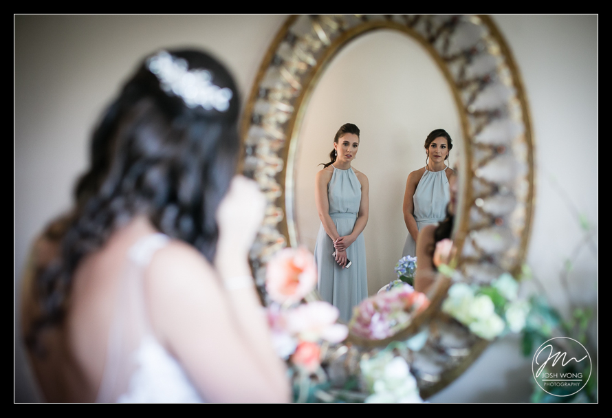 A reflection of the bridesmaids watching the bride getting ready. Best candid and real moments. Wedding photos by top New York Wedding Photographer Josh Wong Photography
