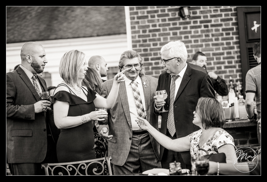 Guest mingle during the cocktail hour.  A Heritage Club at Bethpage NY wedding reception. Wedding photos by Top New York Wedding Photographers.
