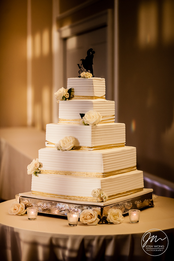 A beautiful 5 tiered wedding cake provided by Le Chateau. A Le Chateau Banquet wedding with photos featured by Hudson Valley's best wedding photographers Josh Wong Photography