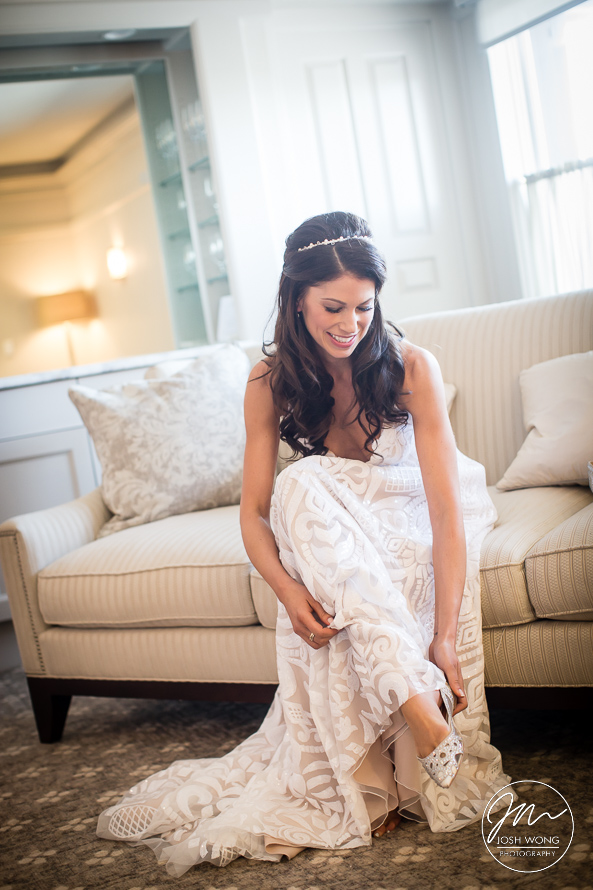 Bride getting ready in the Le Chateau bridal suite. Best wedding candid moments while getting ready. Le Chateau wedding pictures by award winning wedding photographer Josh Wong Photography