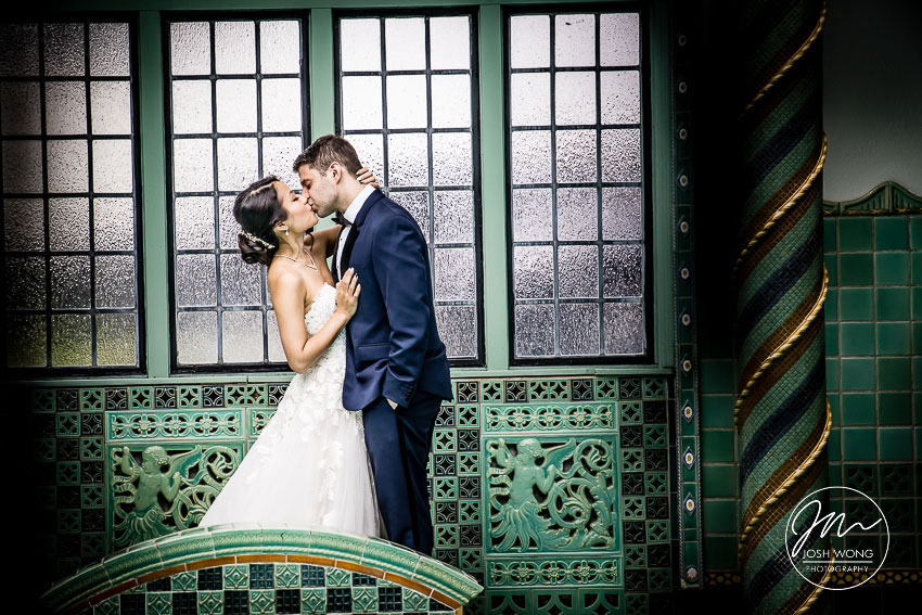 The teal colors tiles by the pool offer amazing bride and groom wedding photos at Pleasantdale