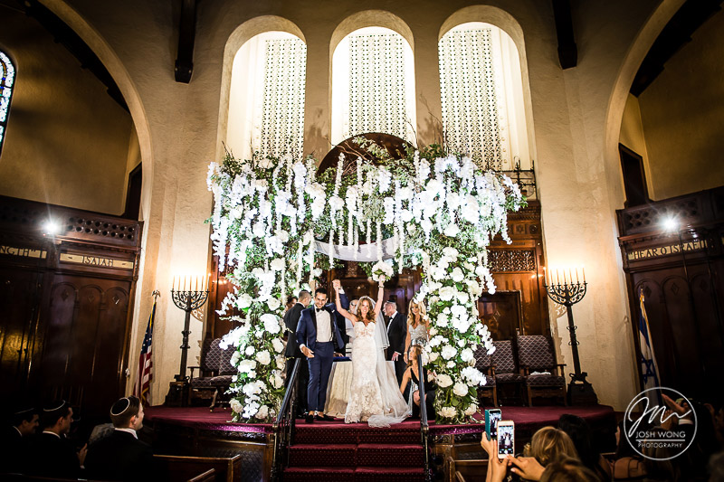 The celebration after the Jewish Wedding Ceremony. Bride and Groom wedding photos. A Jewish wedding at the Temple of Israel in Lawrence, NY by top New York Wedding Photographers Josh Wong Photography