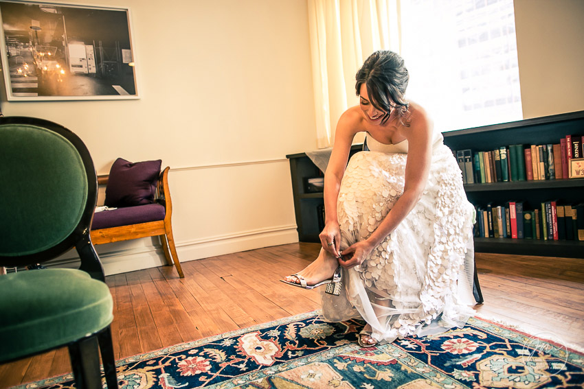 The bride finalizes her wedding day look with some jazzy wedding shoes from Stuart Weitzman. photo credit: Josh Wong Photography