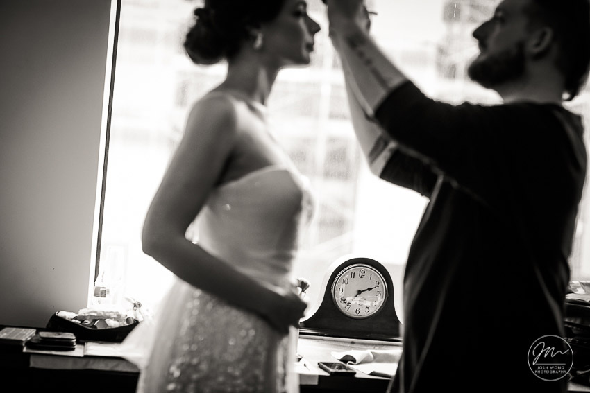 Keep track of time on your wedding day is vital. Candid moments on your wedding day captured by NYC wedding photographer Josh Wong Photography.