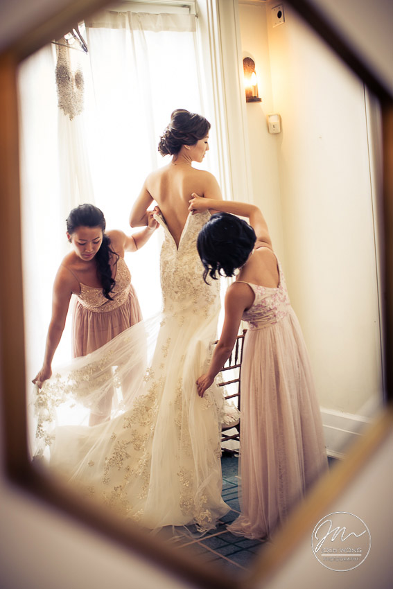 The bride gets into her wedding dress. New York Botanical Garden Wedding Pictures by NYC Wedding Photographer Josh Wong Photography