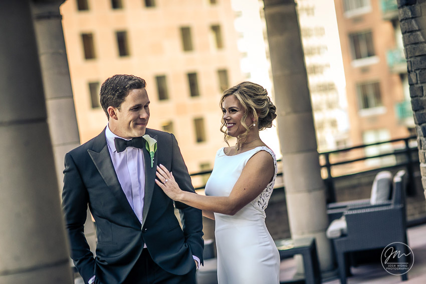 The First Look on the balcony of the bridal suite at Marriott East Side, New York City. Wedding pictures by top NYC wedding photographer Josh Wong.