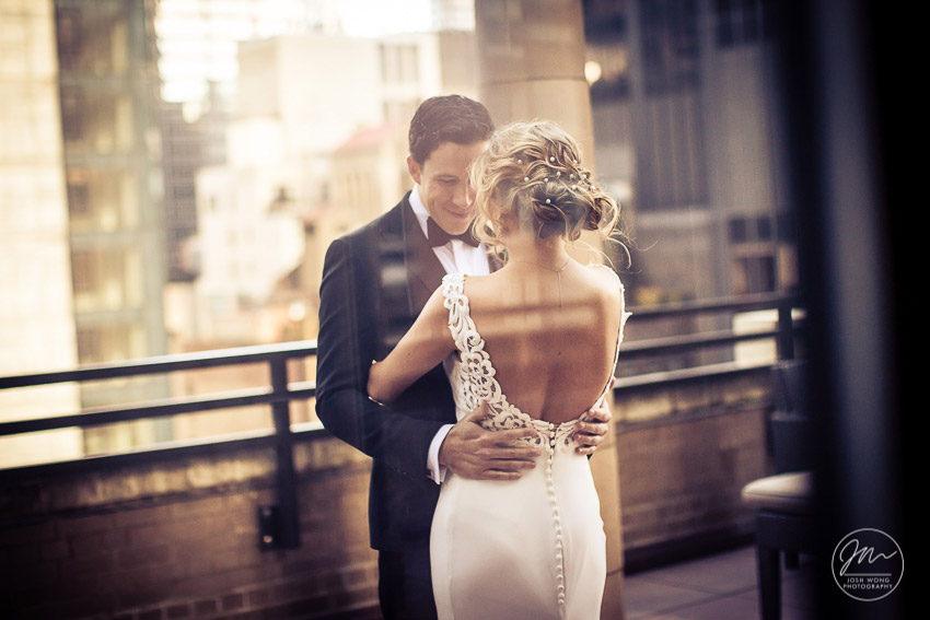 The First Look on the balcony of the bridal suite at Marriott East Side, New York City. Wedding pictures by top NYC wedding photographer Josh Wong.