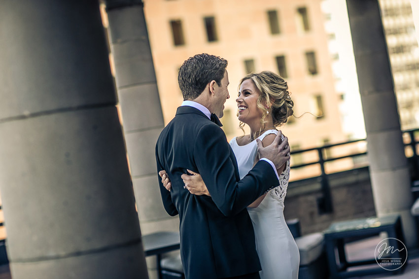 The First Look on the balcony of the bridal suite at Marriott East Side, New York City. Wedding pictures by top NYC wedding photographer Josh Wong.