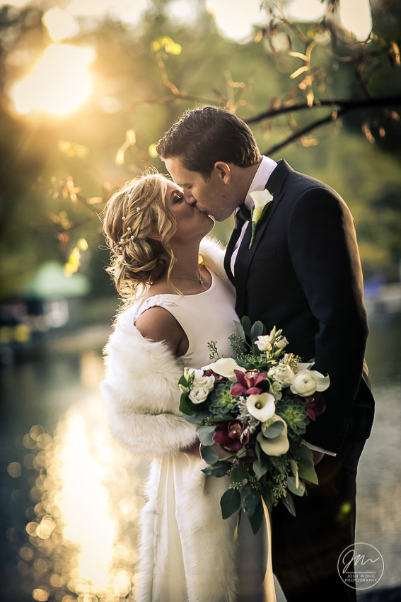 As the sun set over the horizon and glistening over the "The Lake" in Central Park, wedding photos by Josh Wong 