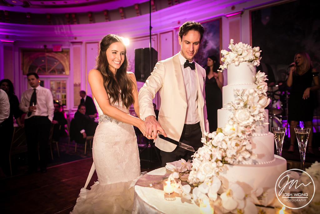 Cake Cutting - Wedding Cake by Ron Ben-Israel Cakes. A Lotte New York Palace Hotel Wedding by top NYC wedding photographers Josh Wong Photography