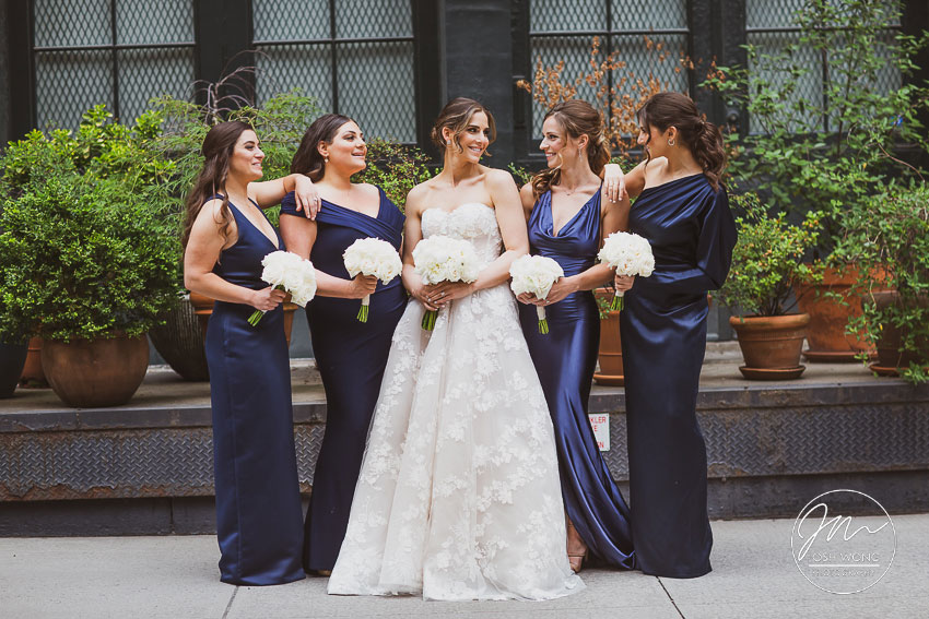 The bride and her bridesmaids in the street of Tribeca