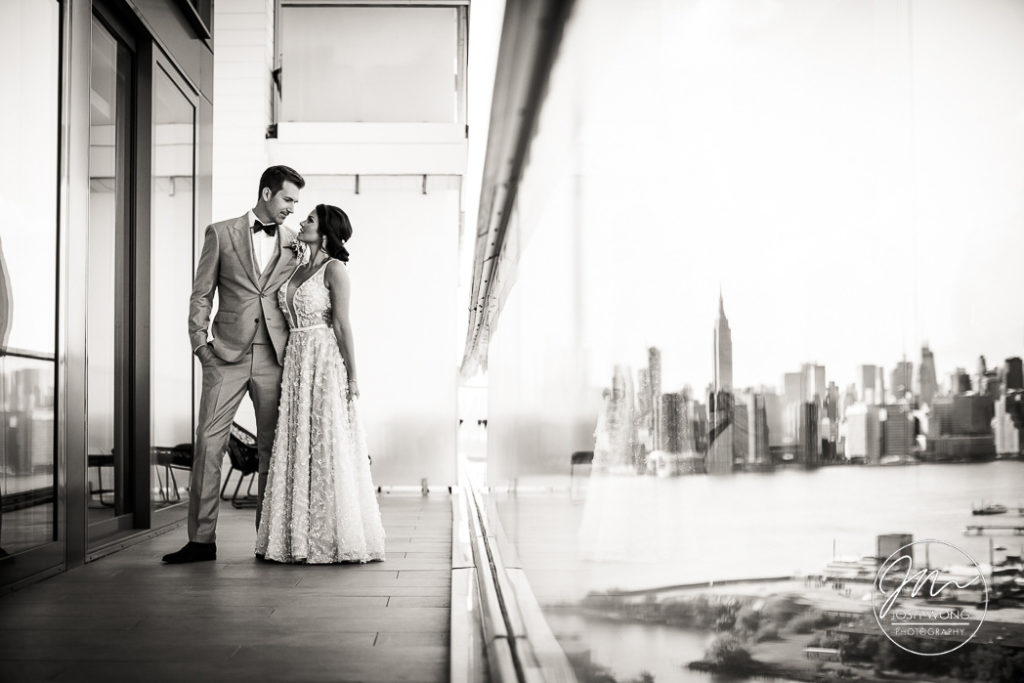 The penthouse bridal suite at The William Vale Hotel has a gorgeous deck with majestic views of the New York City skyline.  William Vale Hotel Wedding photos by top Brooklyn wedding photographer Josh Wong Photography