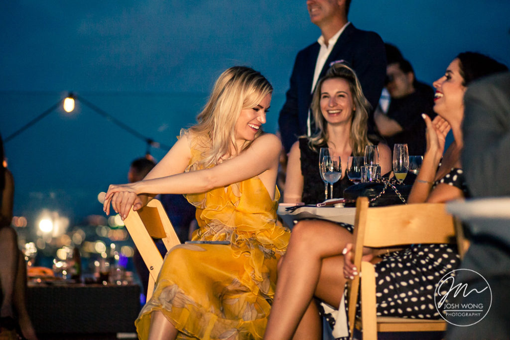 Best candid moments. Guest enjoying their time on the William Vale Rooftop. Best wedding memories. The William Vale wedding pictures by Brooklyn Wedding Photographer Josh Wong Photography